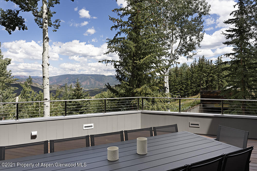 546 Edgewood Lane Snowmass Village, CO 81615 - Photo 47 of 60 a view of roof deck with wooden floor and fence