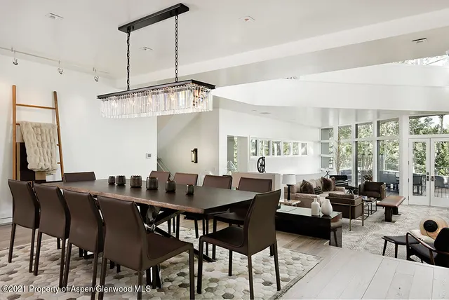 a view of a dining room with furniture window and outside view