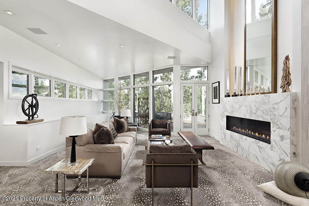 546 Edgewood Lane Snowmass Village, CO 81615 - Photo 52 of 60 a living room with furniture large window and a fireplace