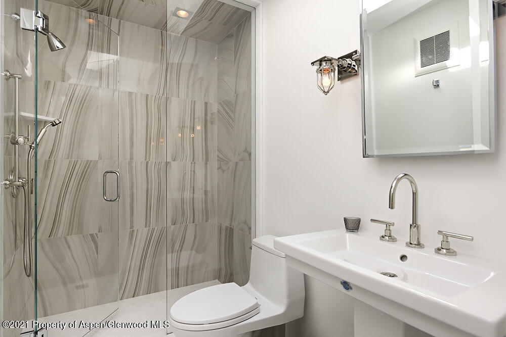 546 Edgewood Lane Snowmass Village, CO 81615 - Photo 53 of 60 a bathroom with a sink a toilet and shower