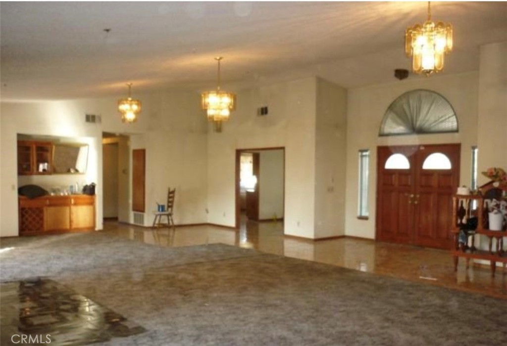 6888 Bookasta Street Adelanto, CA 92301 - Photo 12 of 19 a view of a livingroom with furniture and chandelier fan