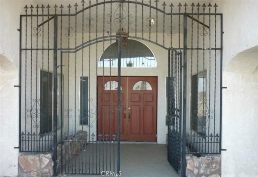 6888 Bookasta Street Adelanto, CA 92301 - Photo 6 of 19 a view of a door with a street view