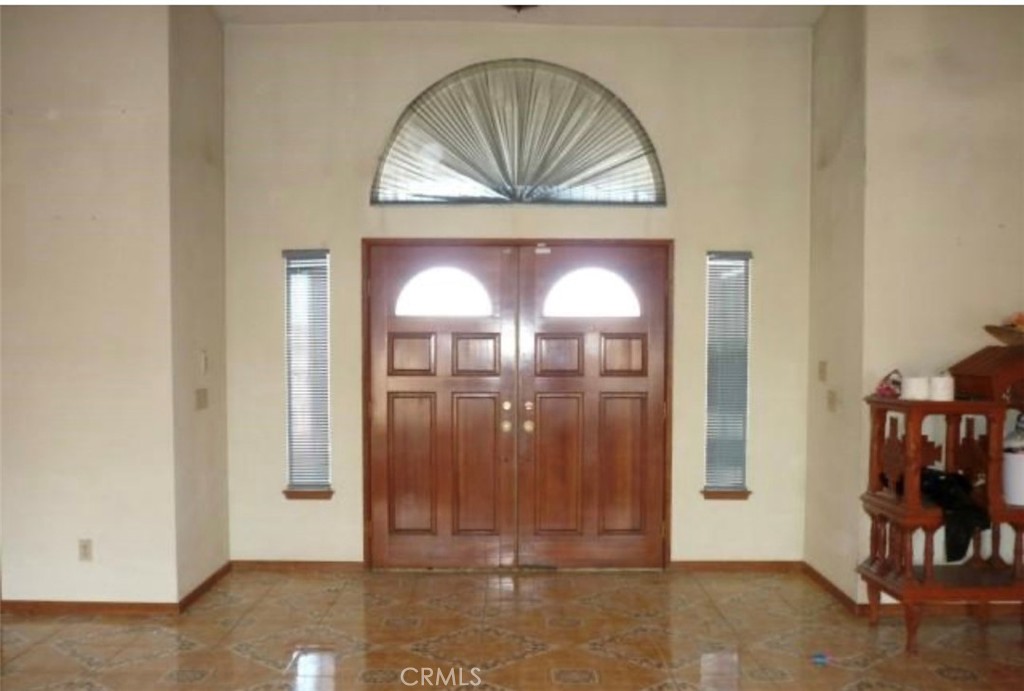 6888 Bookasta Street Adelanto, CA 92301 - Photo 7 of 19 a view of front door with livingroom