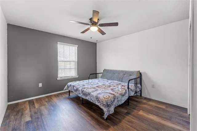 a bedroom with a bed and window
