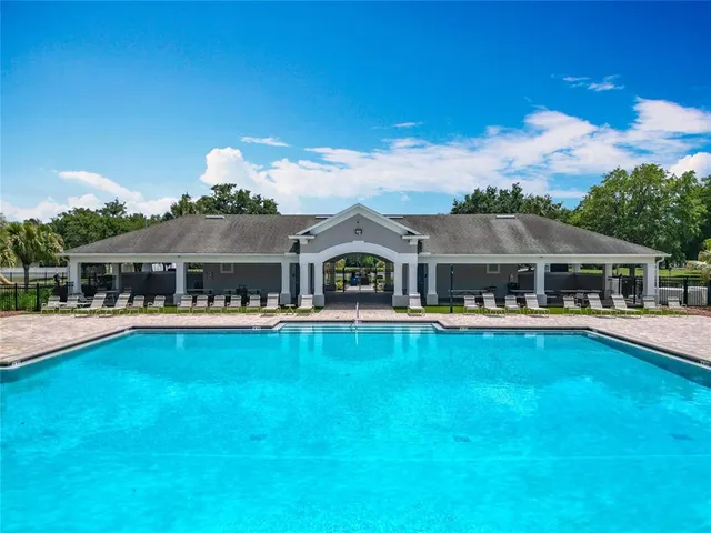 a front view of house with yard and outdoor seating