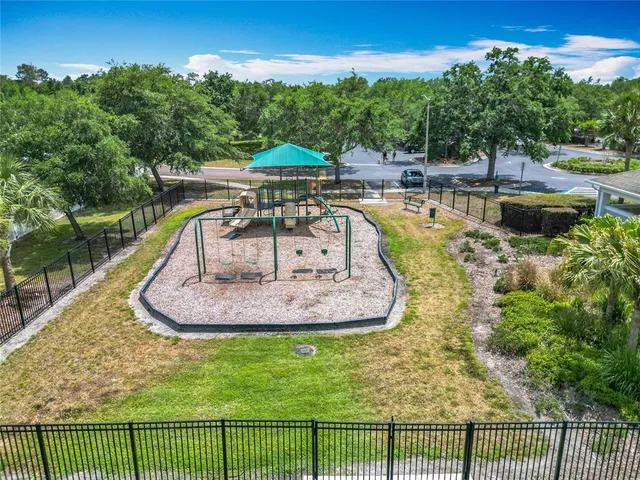a view of a swimming pool with a yard