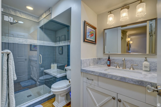 9699 Bypass Road, Unit 5 Alta, UT 84092 - Photo 5 of 54 Bathroom featuring a glass-enclosed shower with subway tile, a vanity with a stone countertop, a rectangular undermount sink, and brushed nickel fixtures