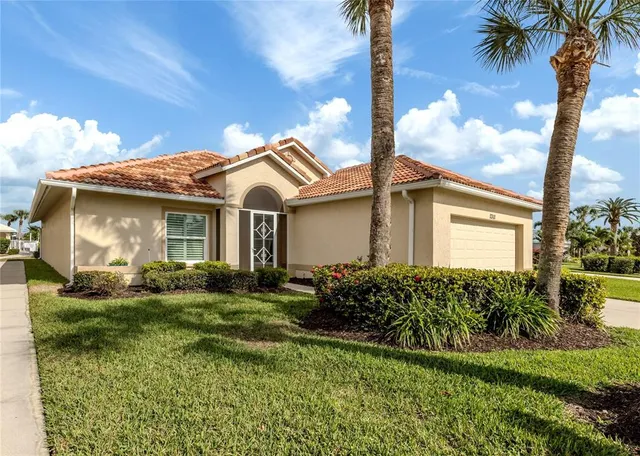 a view of a house with a backyard