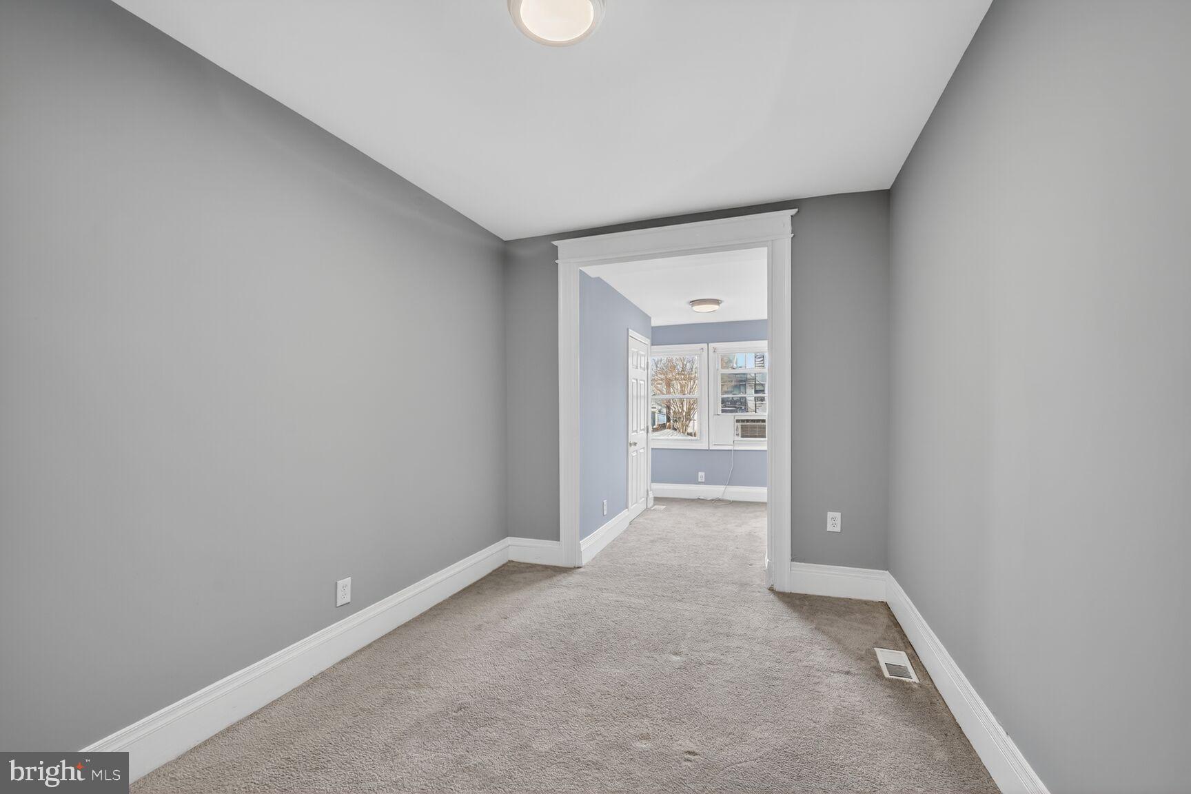 632 Franklin Street Northeast Washington, DC 20017 - Photo 10 of 19 Spacious hallway with soft gray tones.