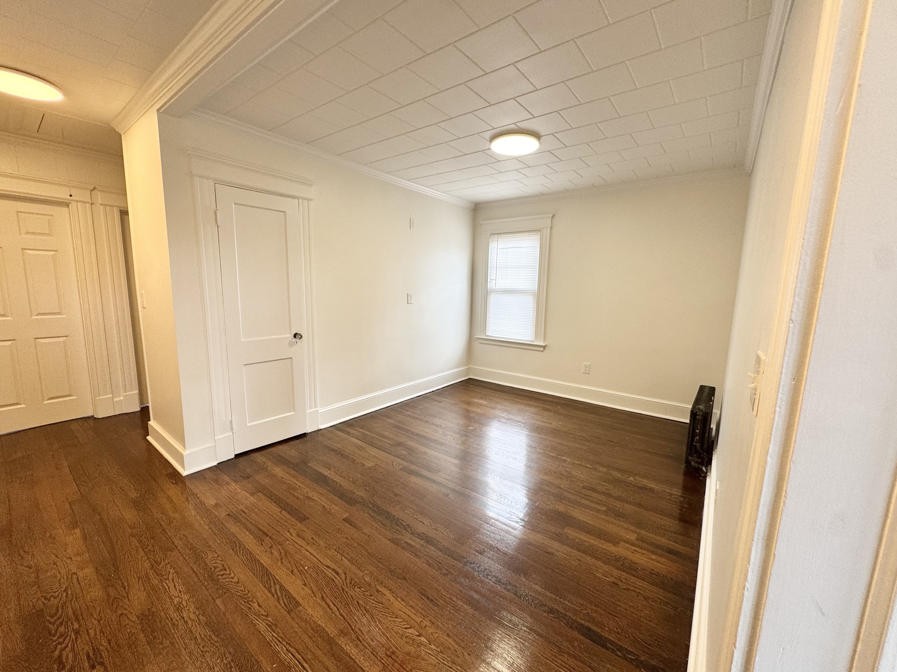 162 High Street Naugatuck, CT 06770 - Photo 14 of 25 an empty room with wooden floor and windows