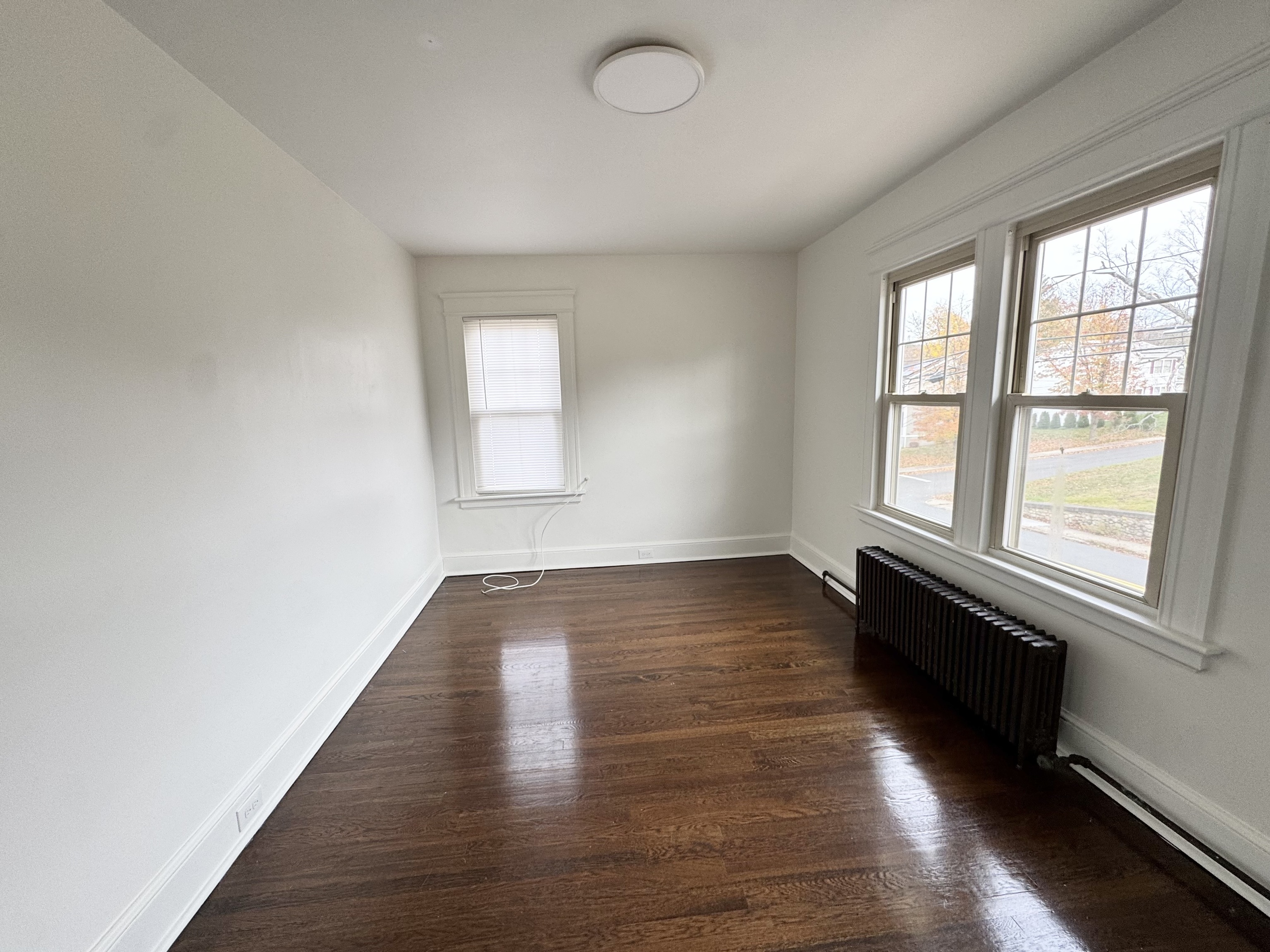 162 High Street Naugatuck, CT 06770 - Photo 19 of 25 an empty room with wooden floor and windows