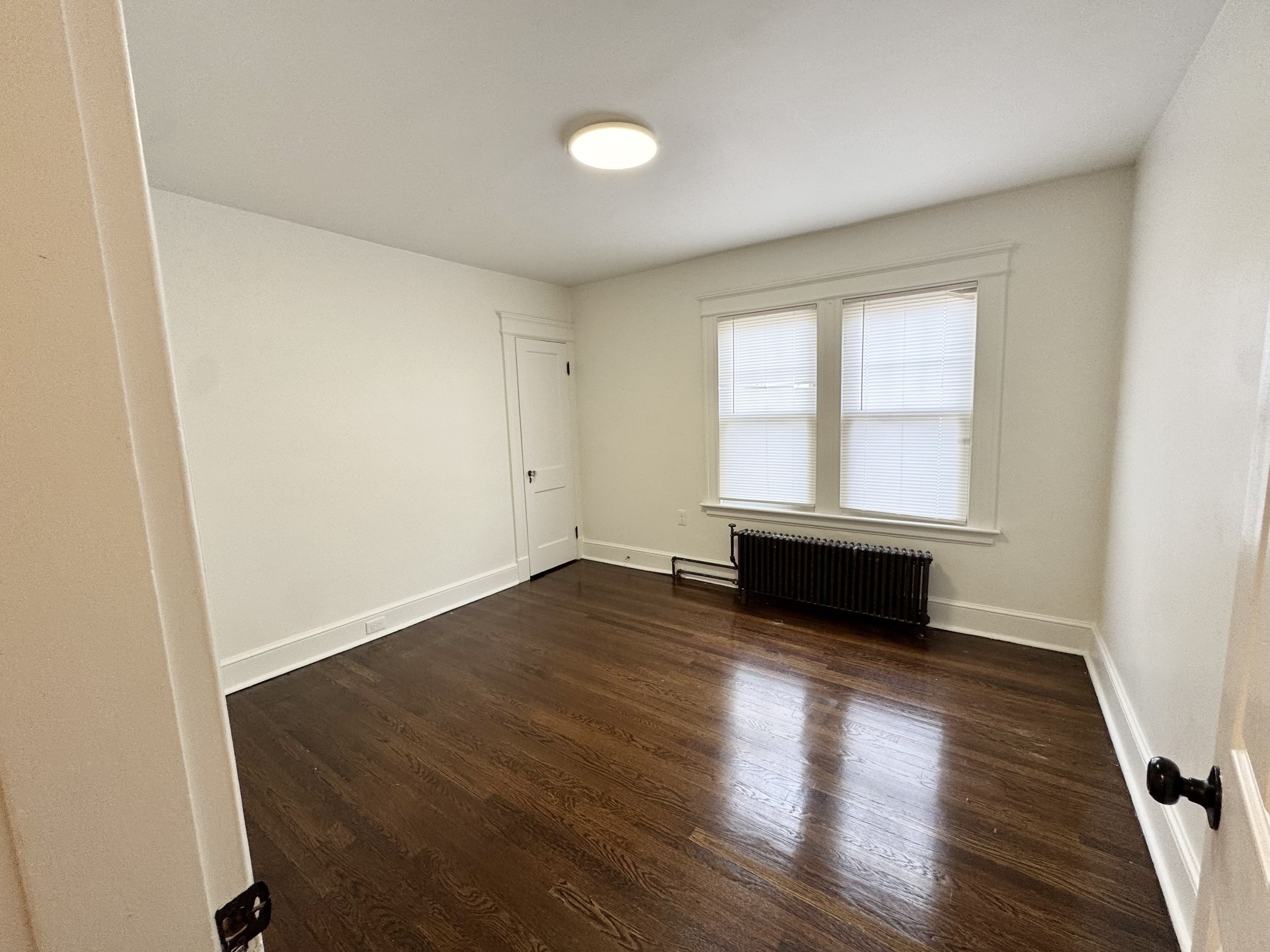 162 High Street Naugatuck, CT 06770 - Photo 22 of 25 an empty room with wooden floor and windows