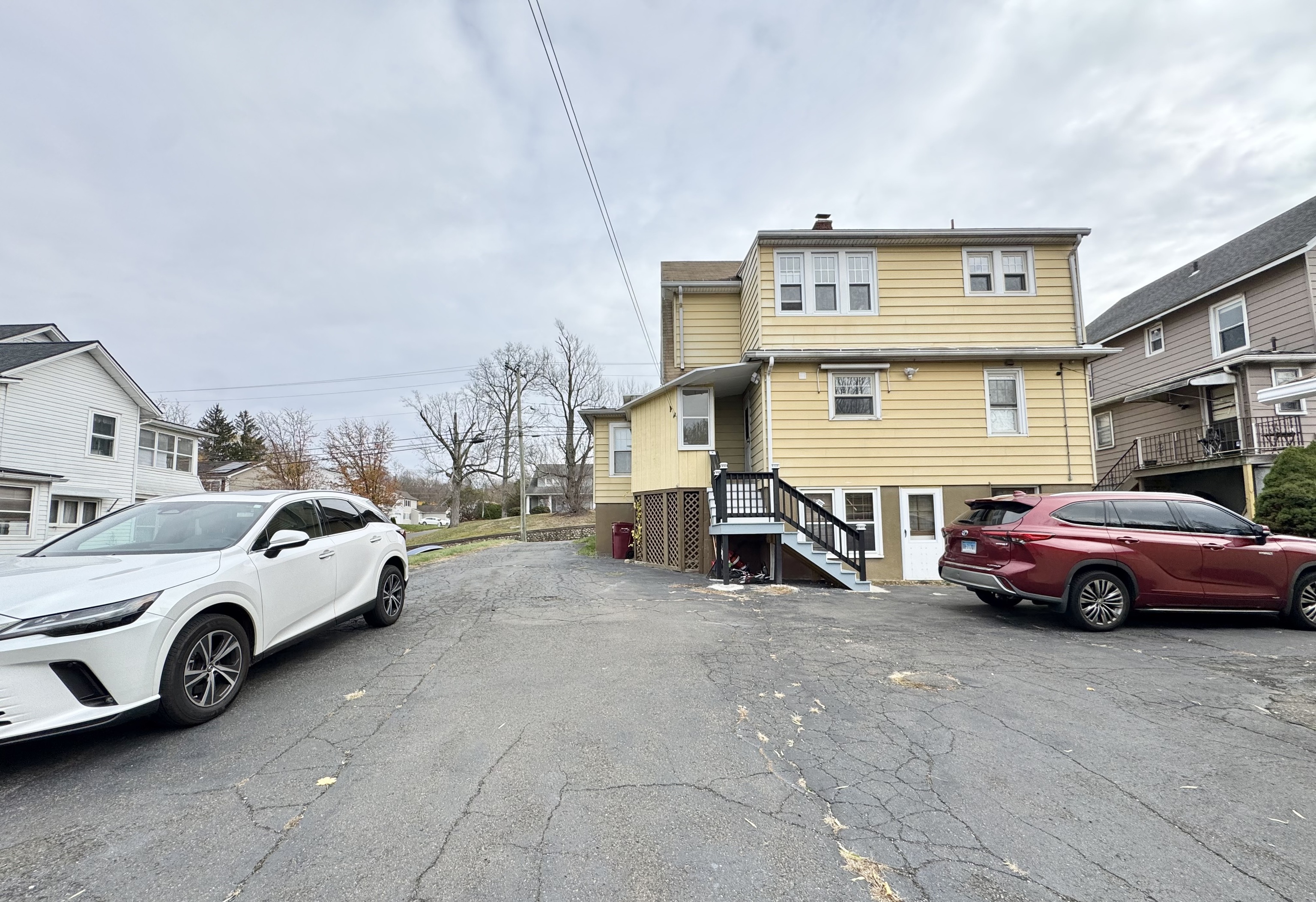 162 High Street Naugatuck, CT 06770 - Photo 25 of 25 a view of cars parked in front of a building