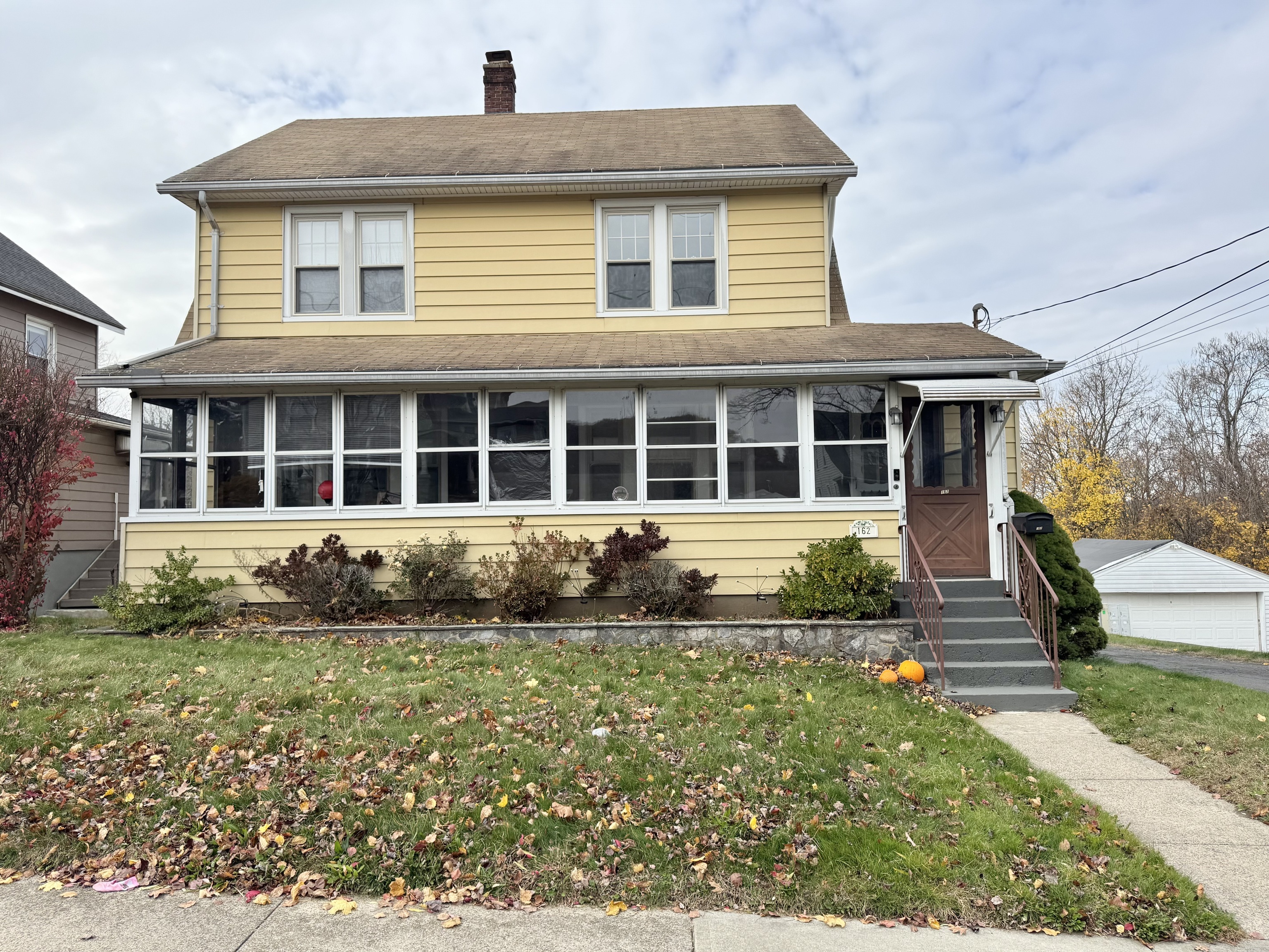 162 High Street Naugatuck, CT 06770 - Photo 5 of 25 a front view of a house with a garden