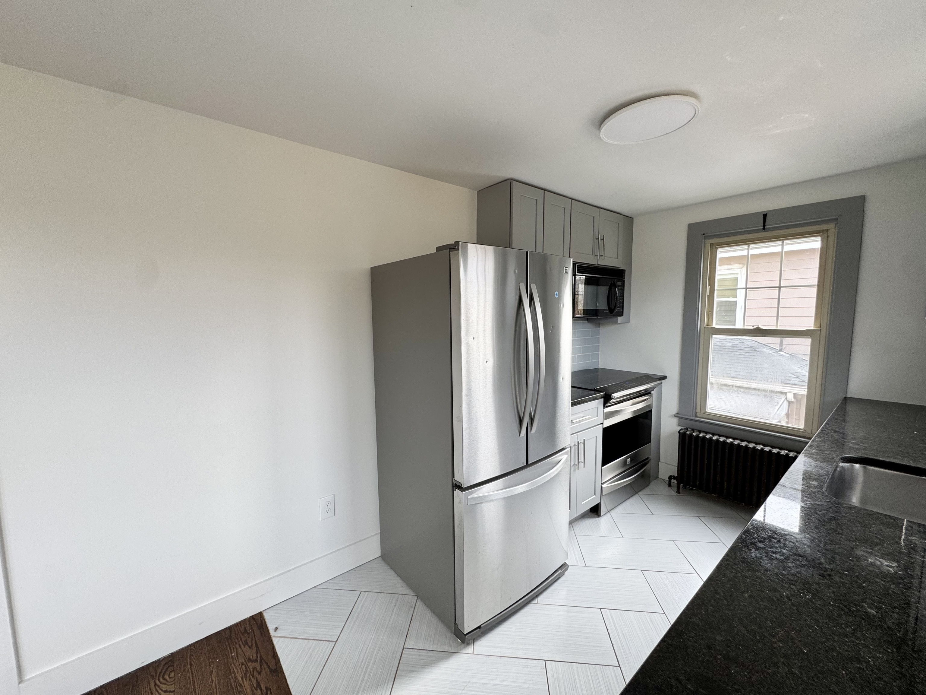 162 High Street Naugatuck, CT 06770 - Photo 10 of 25 a kitchen with a refrigerator and a stove top oven