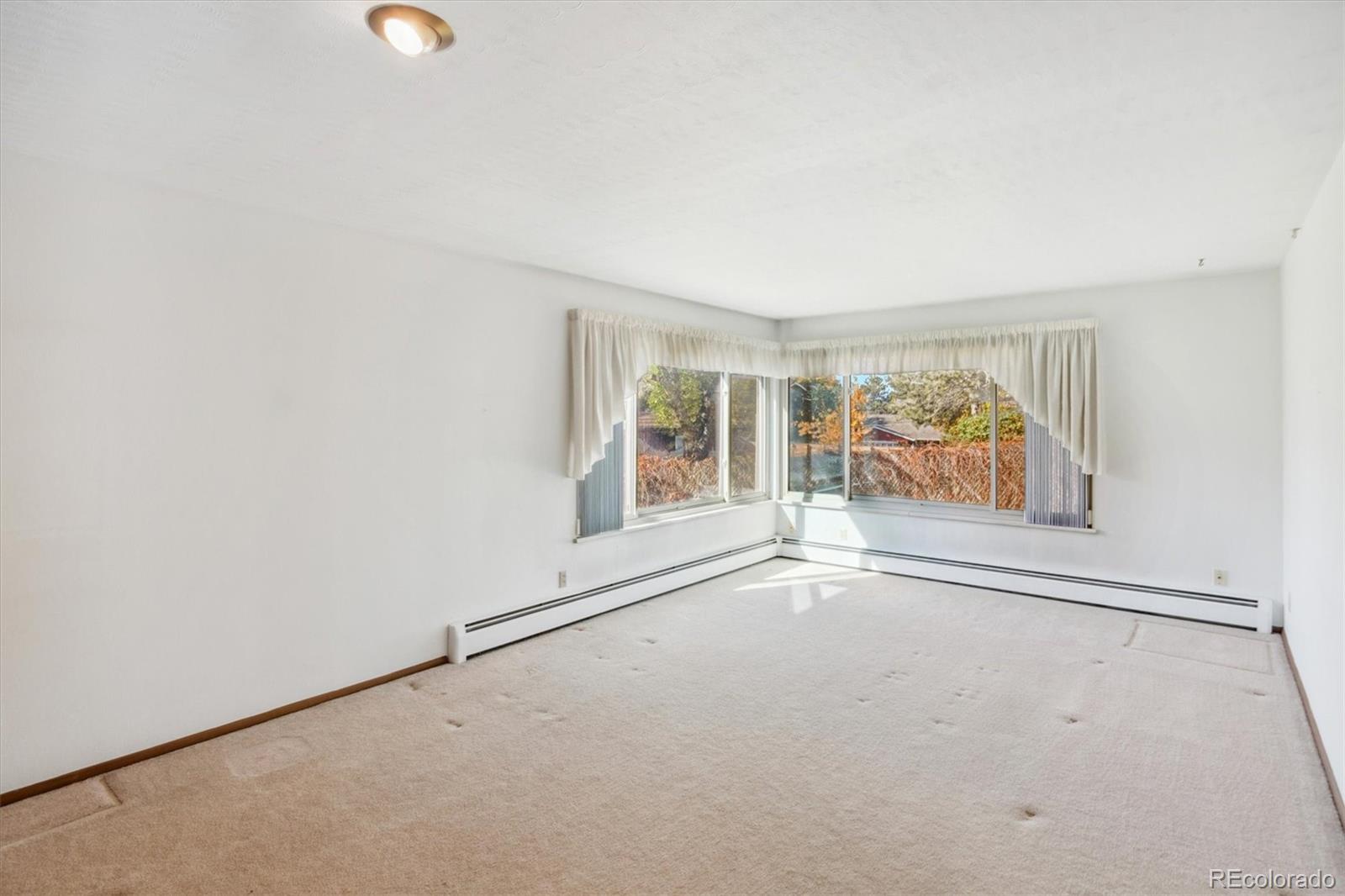 20 Rangeview Place Wheat Ridge, CO 80215 - Photo 13 of 49 an empty room with window