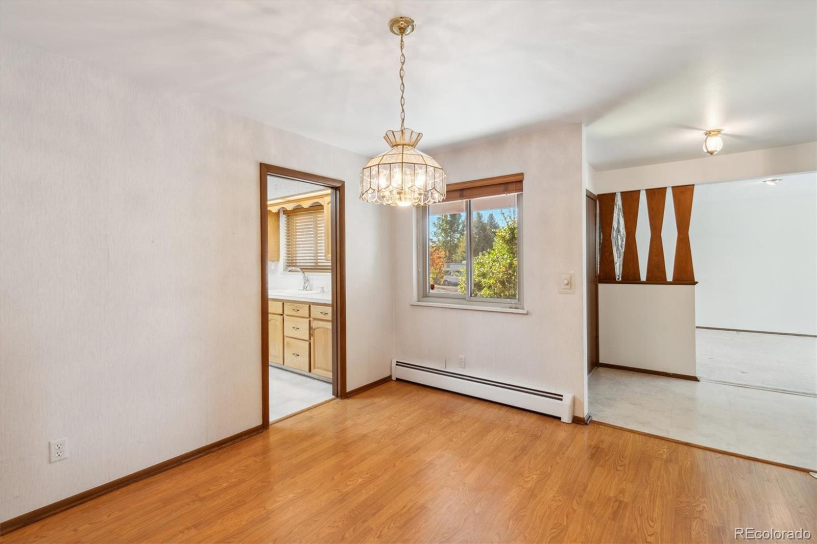 20 Rangeview Place Wheat Ridge, CO 80215 - Photo 15 of 49 an empty room with windows and entrance