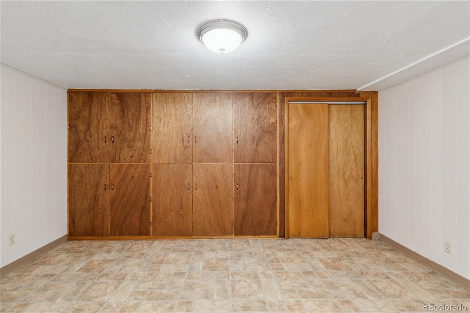 20 Rangeview Place Wheat Ridge, CO 80215 - Photo 26 of 49 an empty room with a wooden door