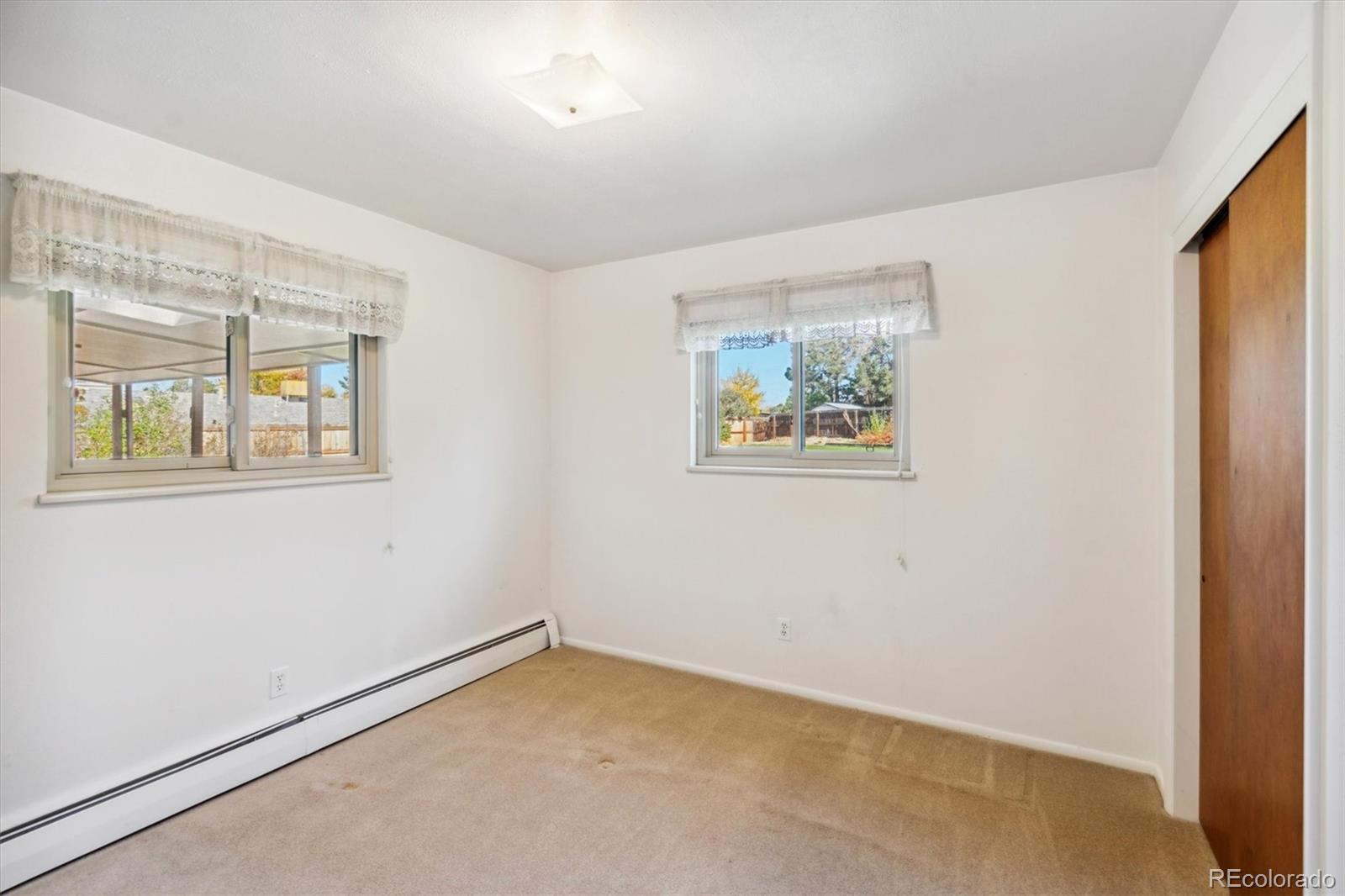 20 Rangeview Place Wheat Ridge, CO 80215 - Photo 27 of 49 an empty room with windows