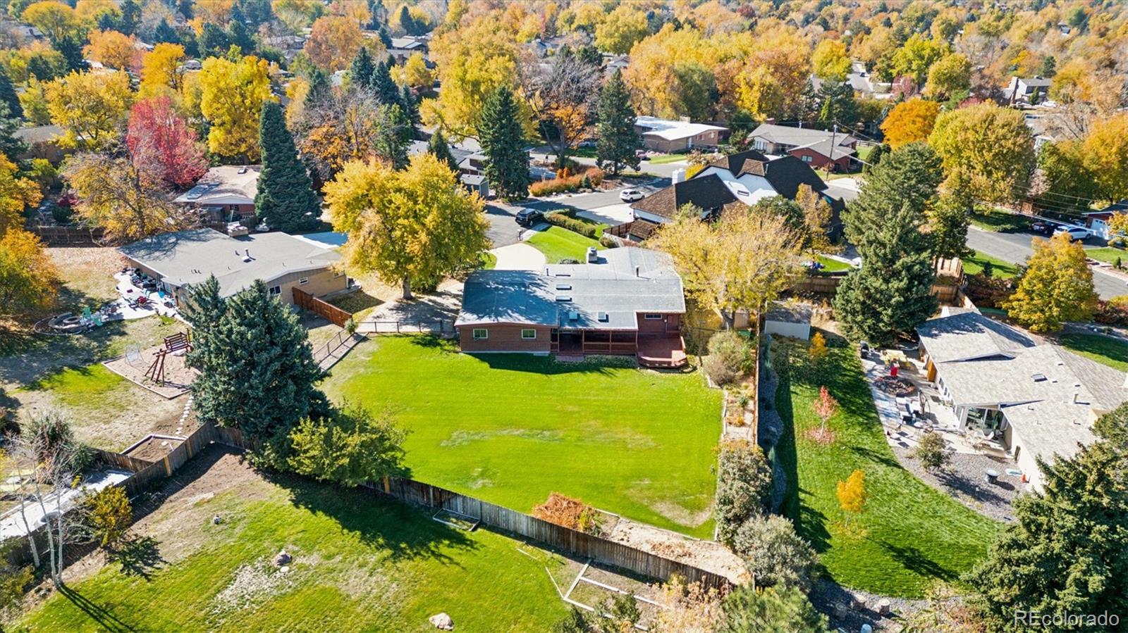 20 Rangeview Place Wheat Ridge, CO 80215 - Photo 7 of 49 an aerial view of a house with a yard swimming pool outdoor seating and yard