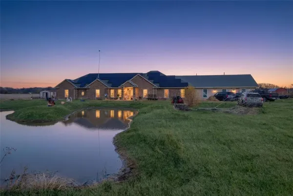 a view of swimming pool in front of house