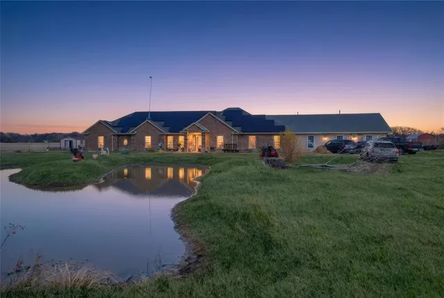 a view of swimming pool in front of house