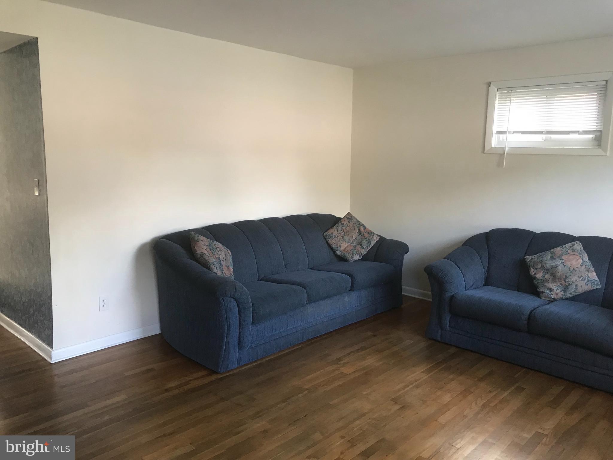 1645 Riverwood Road Baltimore, MD 21221 - Photo 6 of 24 Living room with hardwood flooring