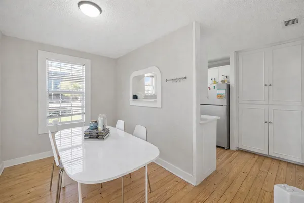 a living room with table and chair