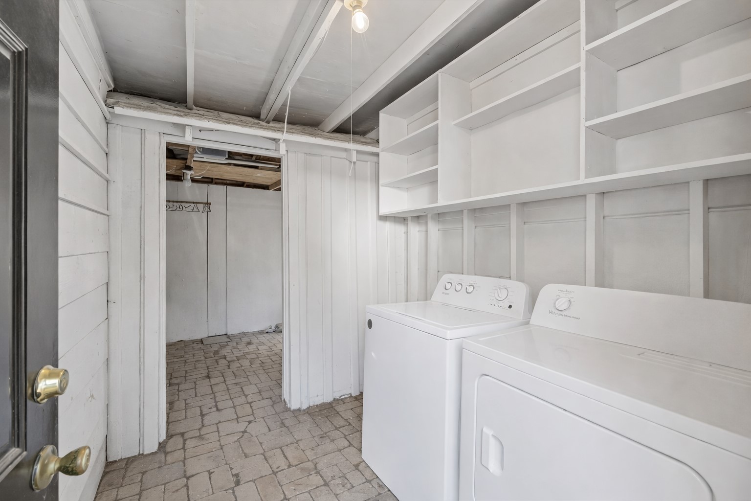 1202 East 29th Street, Unit A Austin, TX 78722 - Photo 20 of 22 Laundry area with separate washer and dryer and brick patterned flooring
