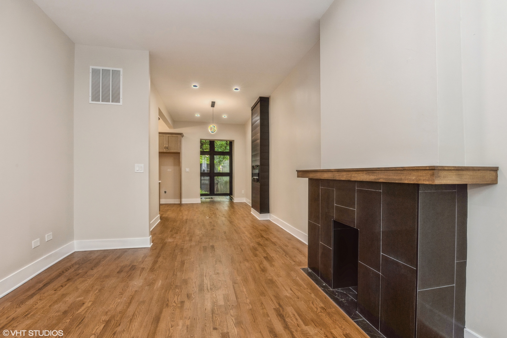 2452 West Lexington Street Chicago, IL 60612 - Photo 3 of 15 a view of empty room with wooden floor
