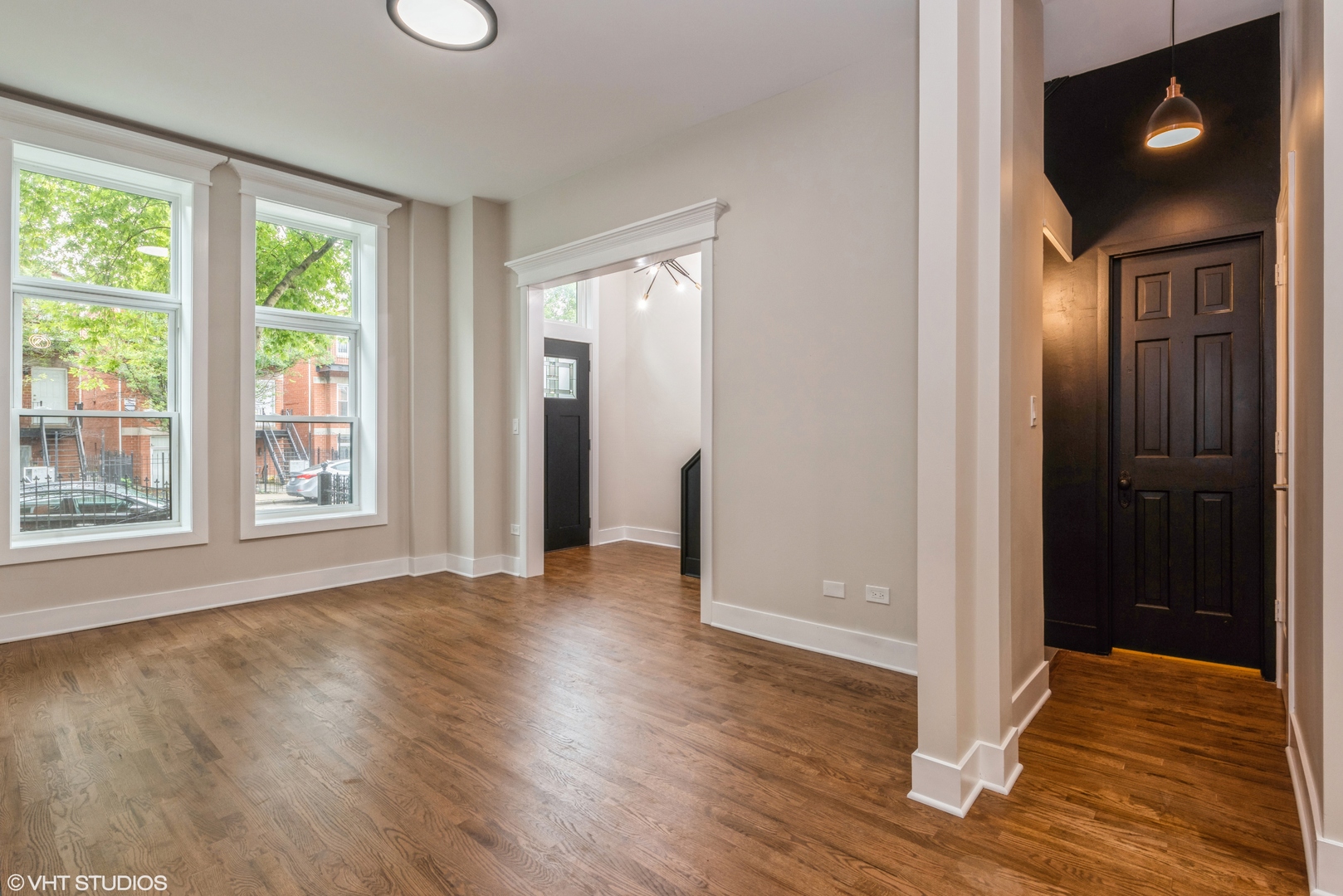 2452 West Lexington Street Chicago, IL 60612 - Photo 4 of 15 an empty room with wooden floor and windows