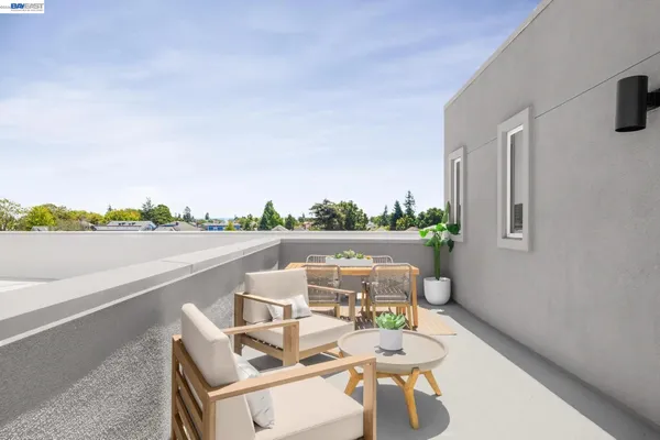 a view of a terrace with couches and a table