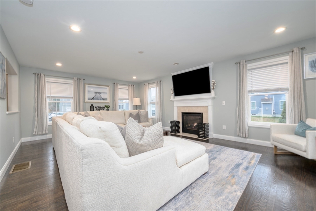 4 Sycamore Lane Bridgewater, MA 02324 - Photo 15 of 42 a living room with fireplace furniture and a flat screen tv