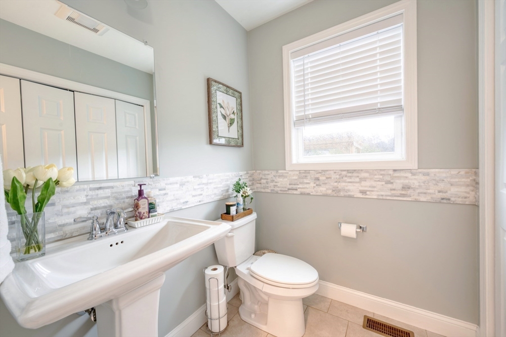 4 Sycamore Lane Bridgewater, MA 02324 - Photo 21 of 42 a bathroom with a sink toilet and a mirror