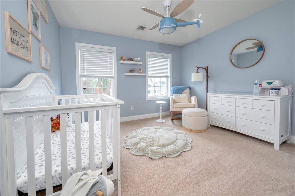 4 Sycamore Lane Bridgewater, MA 02324 - Photo 27 of 42 a bedroom with furniture and a large window
