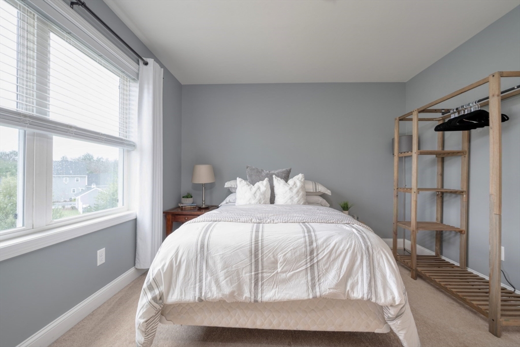 4 Sycamore Lane Bridgewater, MA 02324 - Photo 31 of 42 a bedroom with a bed and a window