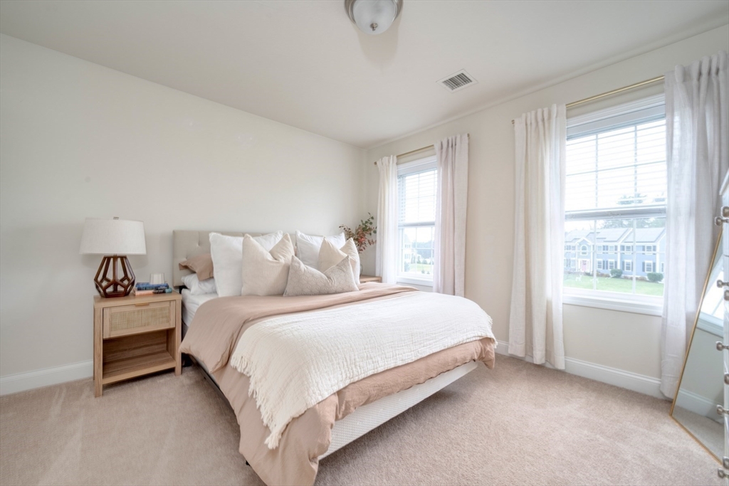 4 Sycamore Lane Bridgewater, MA 02324 - Photo 32 of 42 a bedroom with a bed and a window