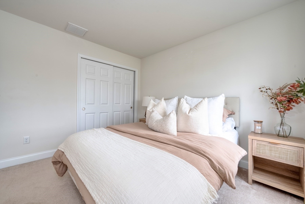 4 Sycamore Lane Bridgewater, MA 02324 - Photo 33 of 42 a bedroom with bed and a potted plant