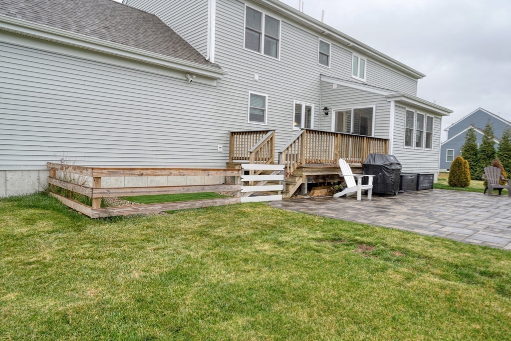 4 Sycamore Lane Bridgewater, MA 02324 - Photo 37 of 42 a view of a house with backyard and a chair