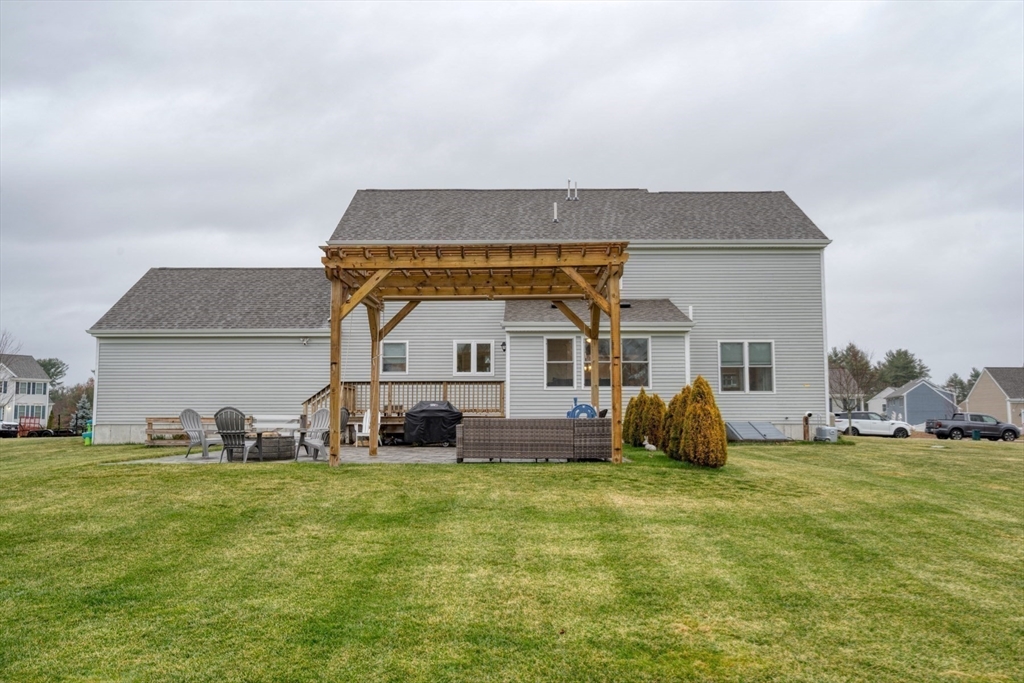 4 Sycamore Lane Bridgewater, MA 02324 - Photo 38 of 42 a front view of a house with a yard