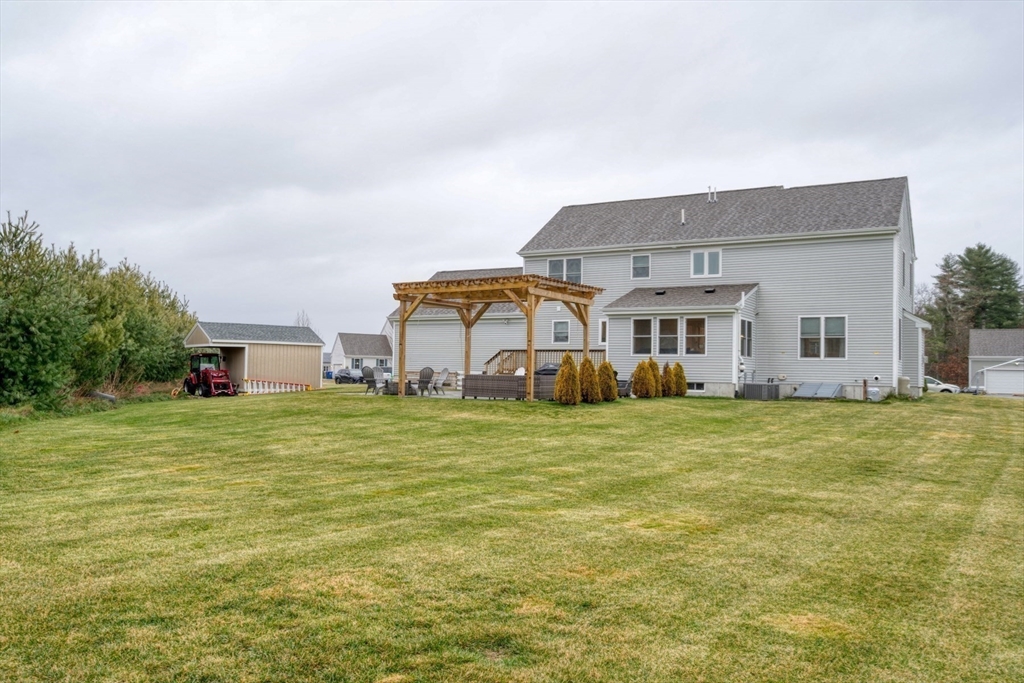 4 Sycamore Lane Bridgewater, MA 02324 - Photo 39 of 42 a front view of a house with a garden