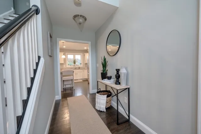 a room with wooden floor and glass door