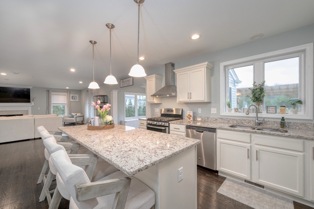 4 Sycamore Lane Bridgewater, MA 02324 - Photo 10 of 42 a kitchen with granite countertop sink stove and dining table