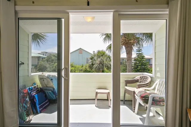 a view of a room that has a bed and a window