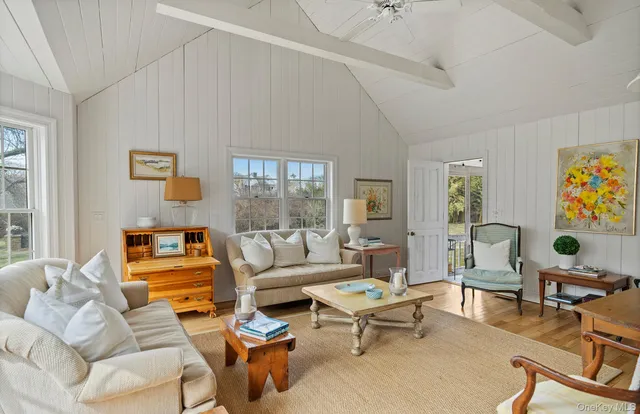 a living room with furniture and a table