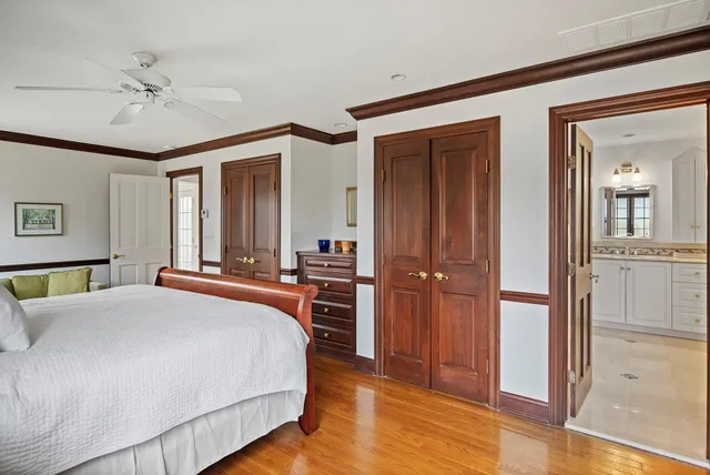 a bedroom with furniture and a rug