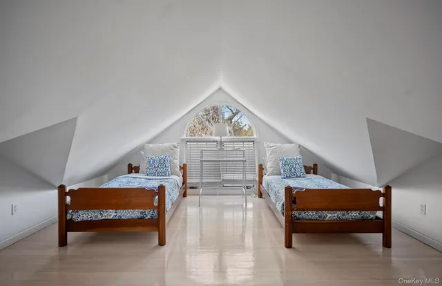 a living room with furniture and a clock