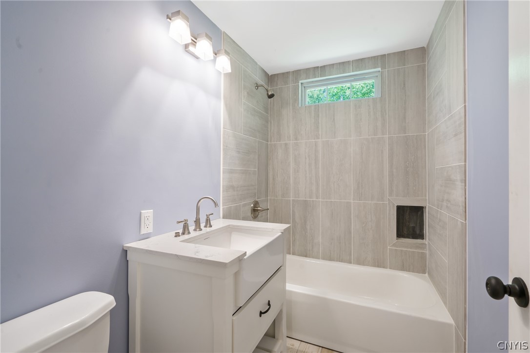 563 County Rte 12 Schroeppel, NY 13132 - Photo 26 of 39 This 2nd full bath of the bedroom wing is equally jaw-dropping with a luxe feel! The tile work is truly remarkable!