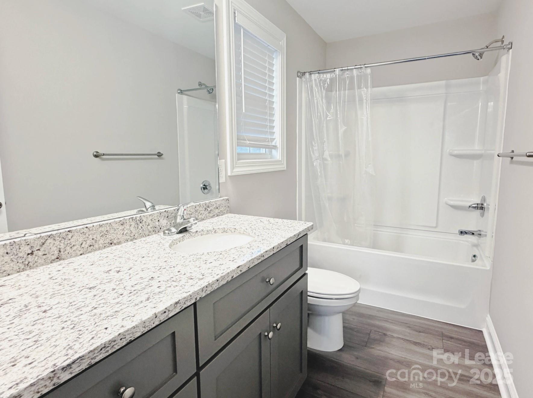 921 Pineridge Street Southeast Concord, NC 28025 - Photo 8 of 13 a bathroom with a granite countertop sink a toilet and shower