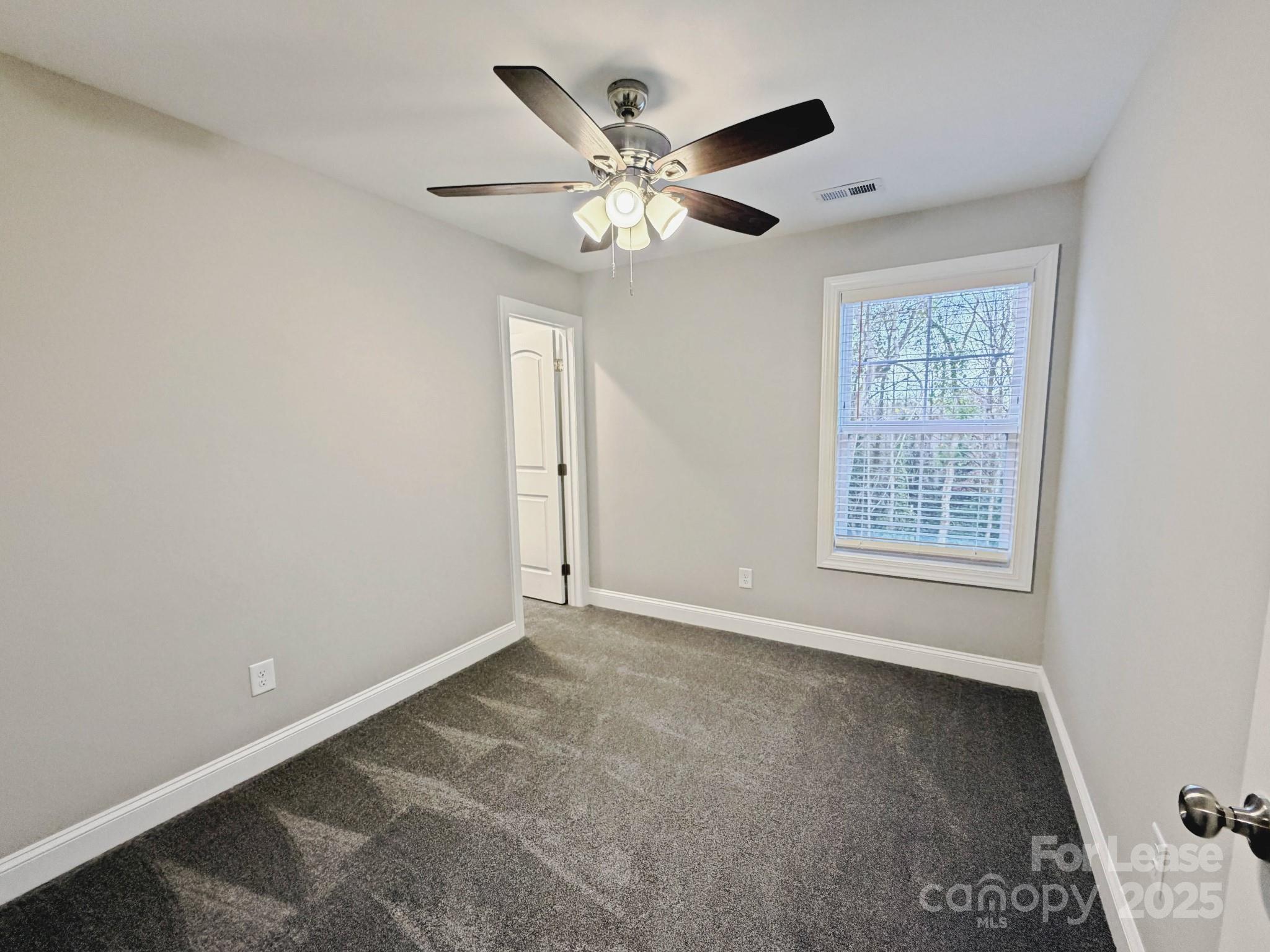 921 Pineridge Street Southeast Concord, NC 28025 - Photo 10 of 13 a view of an empty room with a window